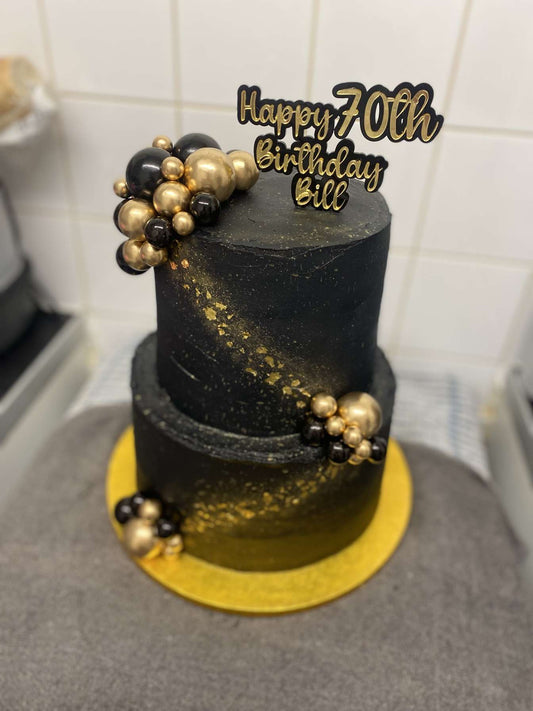 Dark two tier birthday cake